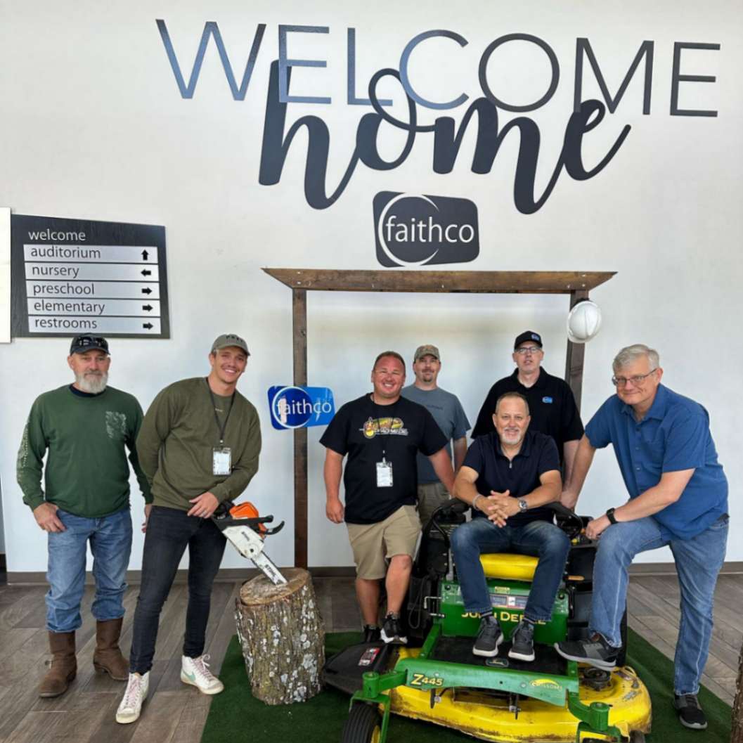 a group of men posing for a photo